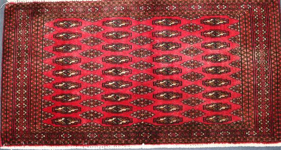 A Turkoman small red ground rug, 3ft 8in by 2ft.